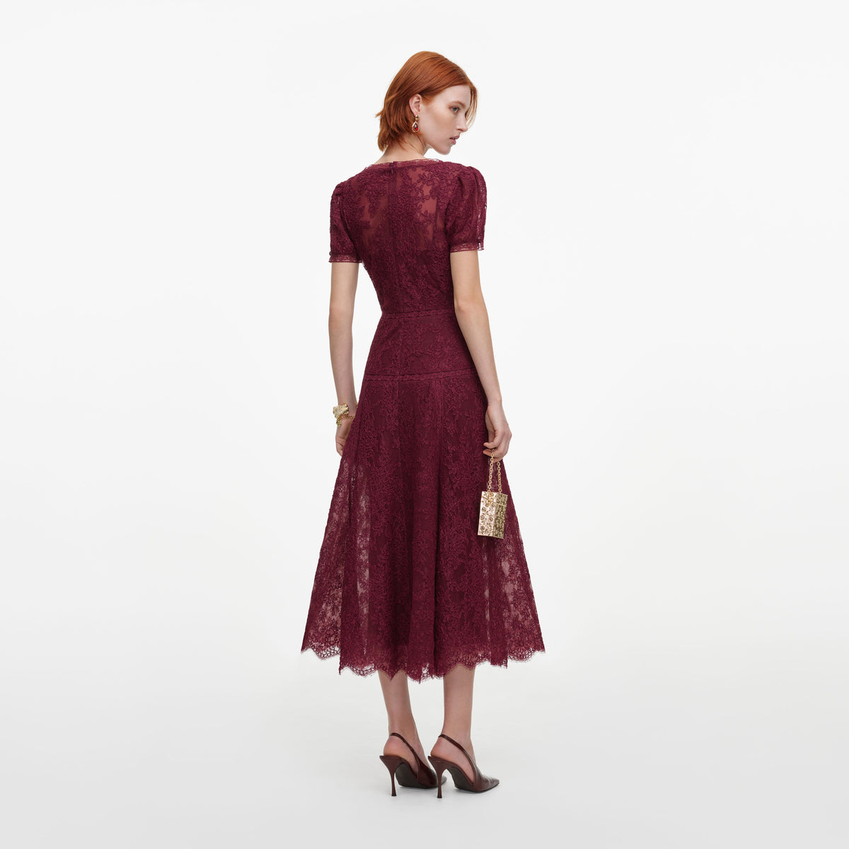 Back view of a woman wearing the Burgundy Lace Midi Dress