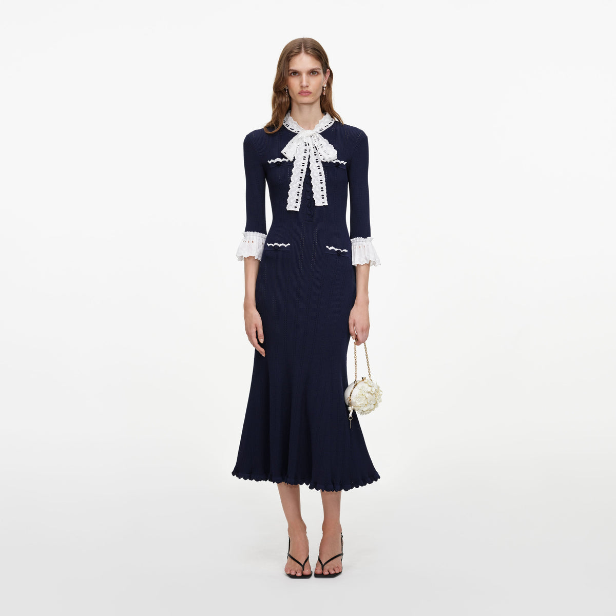 Front view of a woman wearing the Navy Pointelle Lace Knit Midi Dress