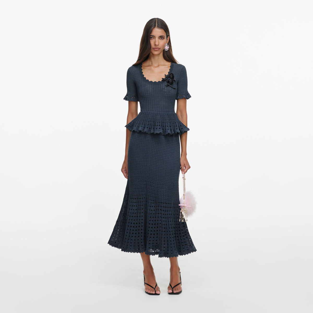 Front view of a woman wearing the Grey Pointelle Peplum Knit Midi Dress