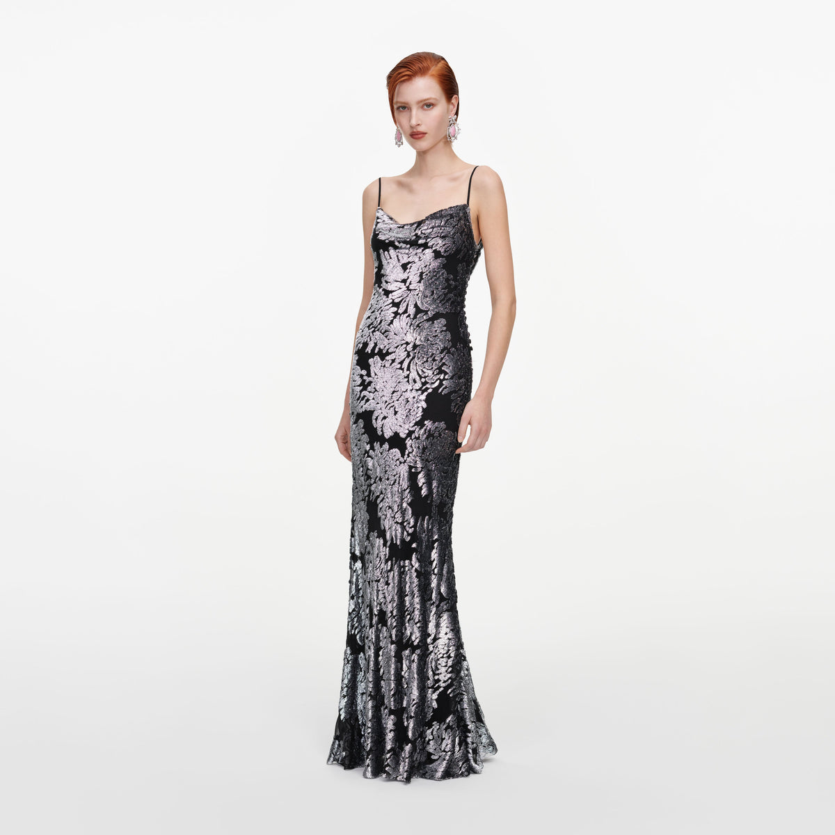 Side view of a woman wearing the Silver Fil Coupe Maxi Dress