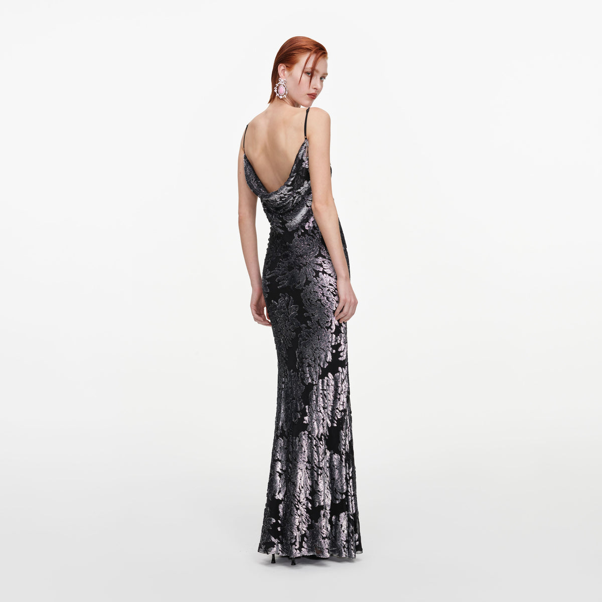 Back view of a woman wearing the Silver Fil Coupe Maxi Dress