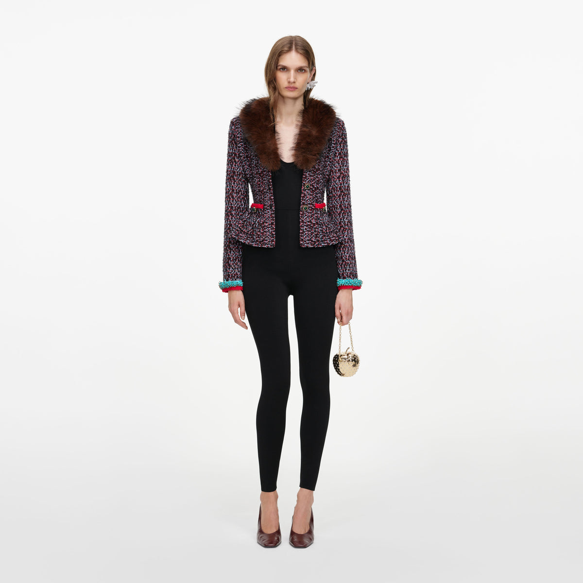 Front view of a woman wearing the Multi Textured Knit Peplum Cardigan