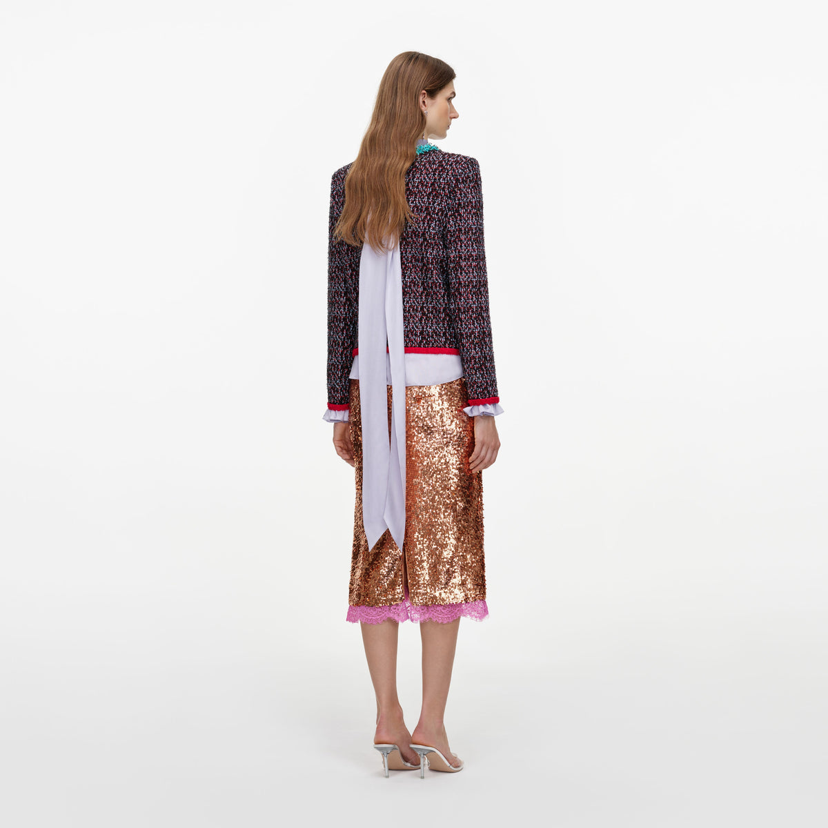 Back view of a woman wearing the Multi Textured Knit Cardigan