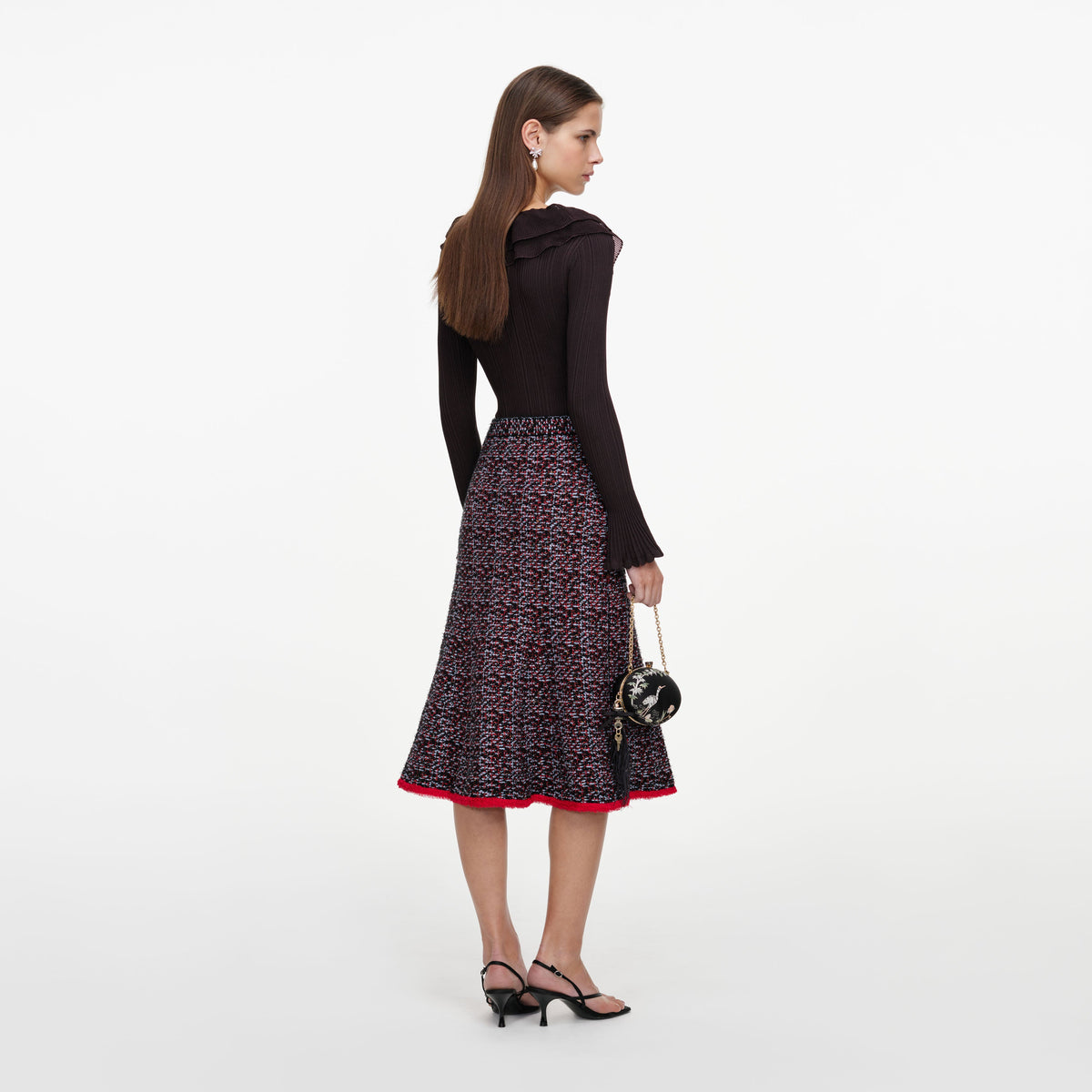 Back view of a woman wearing the Multi Textured Knit Midi Skirt