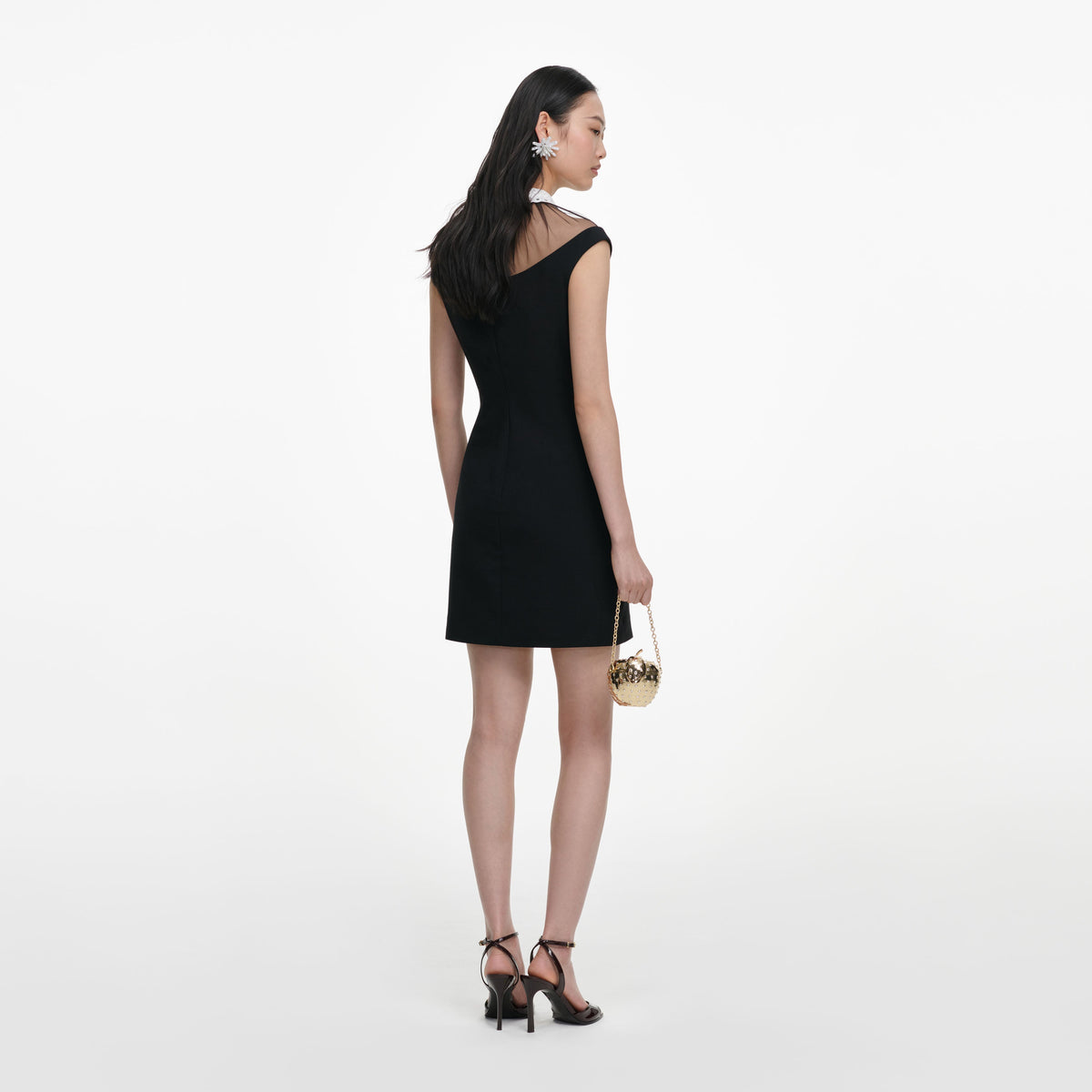Back view of a woman wearing the Black Crepe Contrast Collar Mini Dress