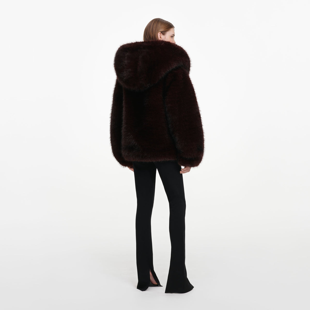 Back view of a woman wearing the Brown Faux Fur Hooded Jacket