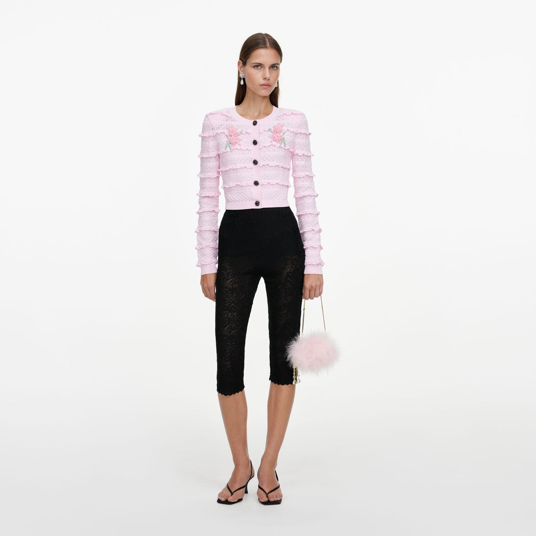 Front view of a woman wearing the Pink Flower Pointelle Knit Cardigan