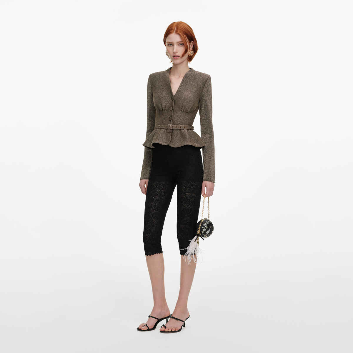 Side view of a woman wearing the Bronze Tailored Knit Top