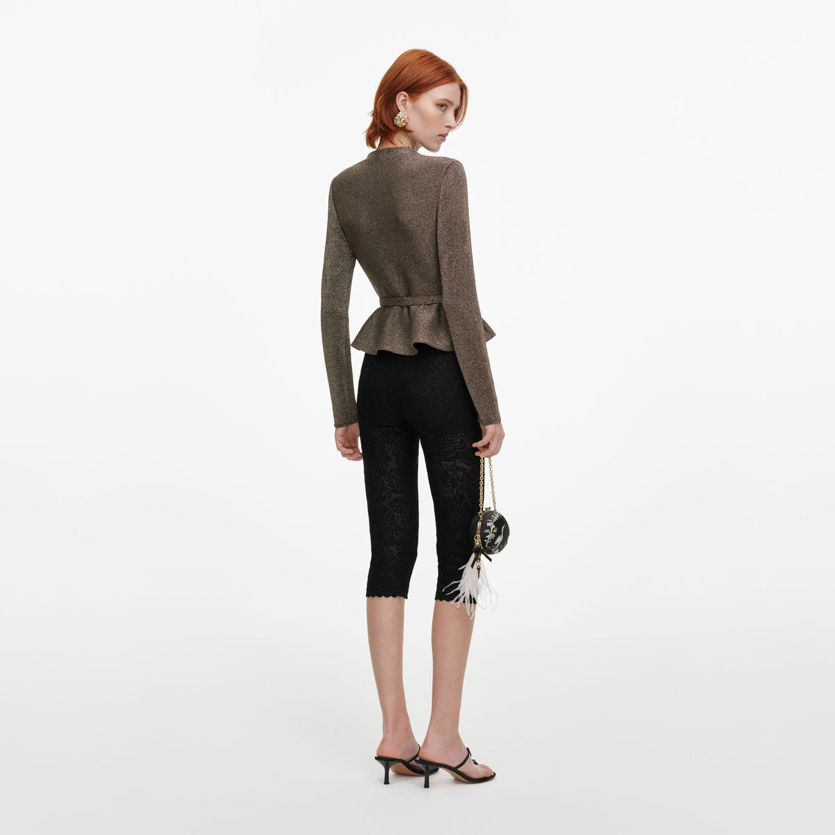 Back view of a woman wearing the Bronze Tailored Knit Top