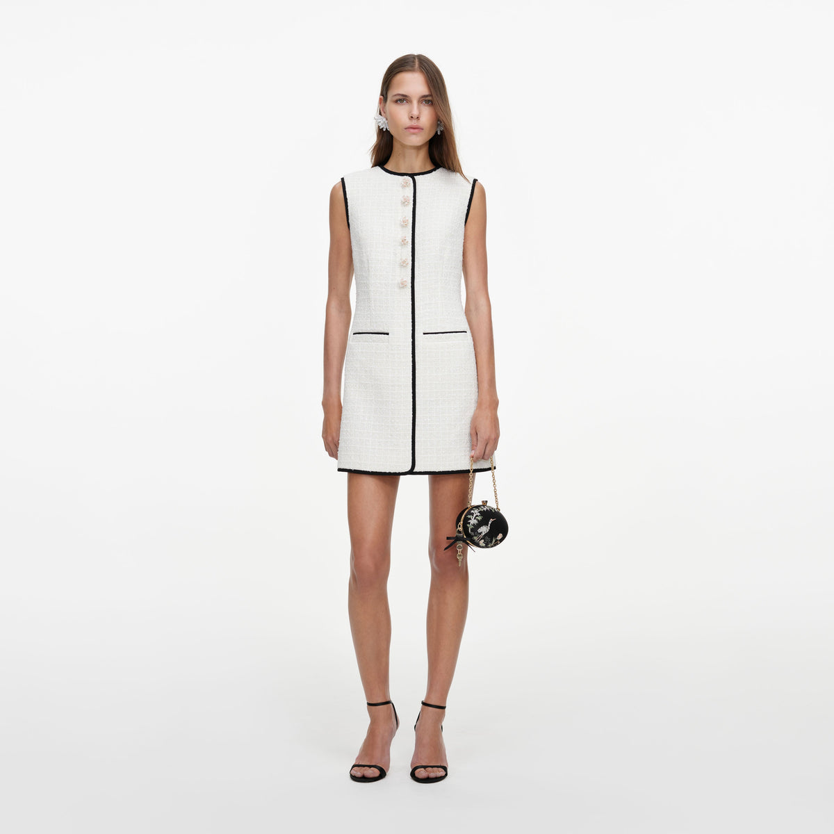 Front view of a woman wearing the Cream Sleeveless Boucle Mini Dress