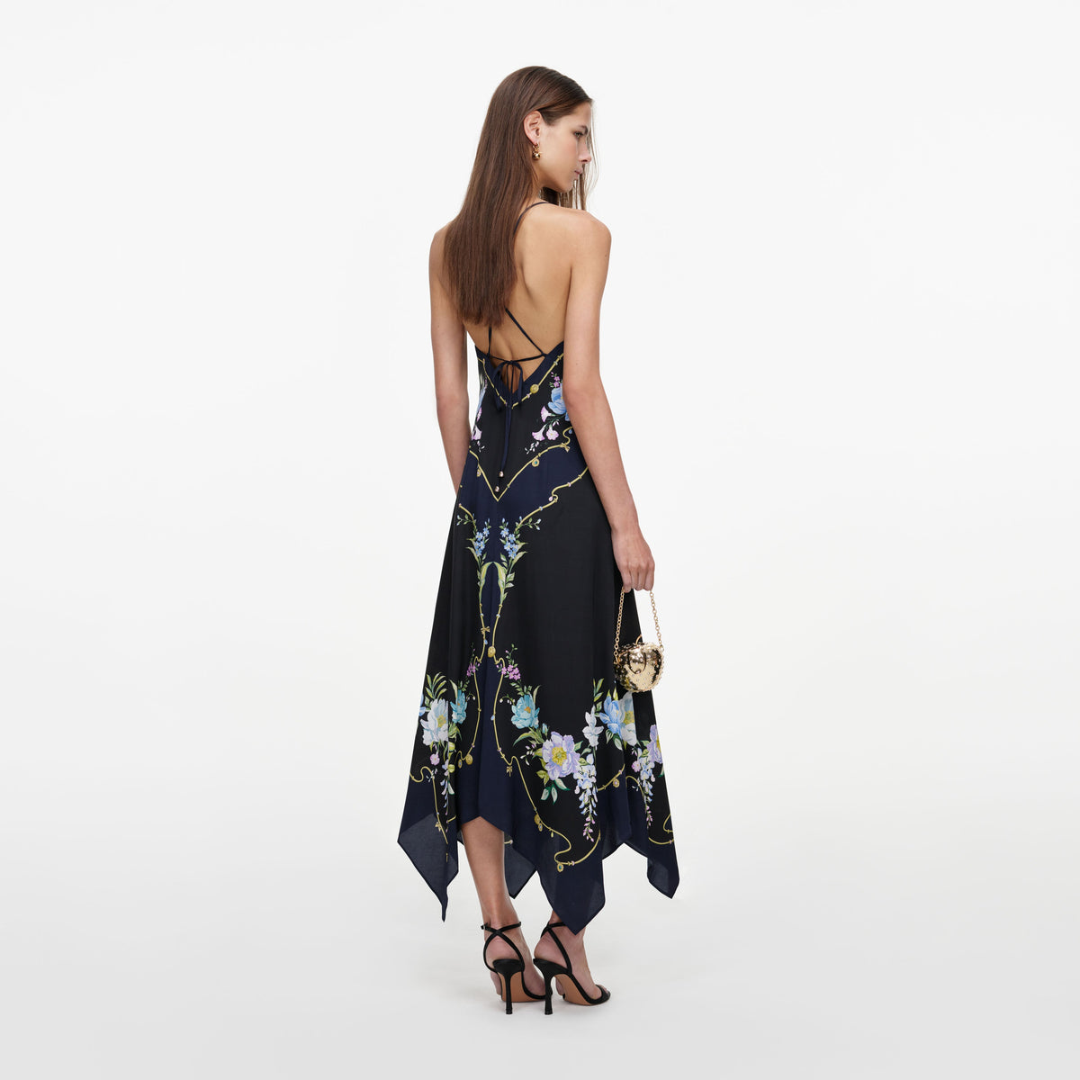 Back view of a woman wearing the Navy Floral Midi Dress