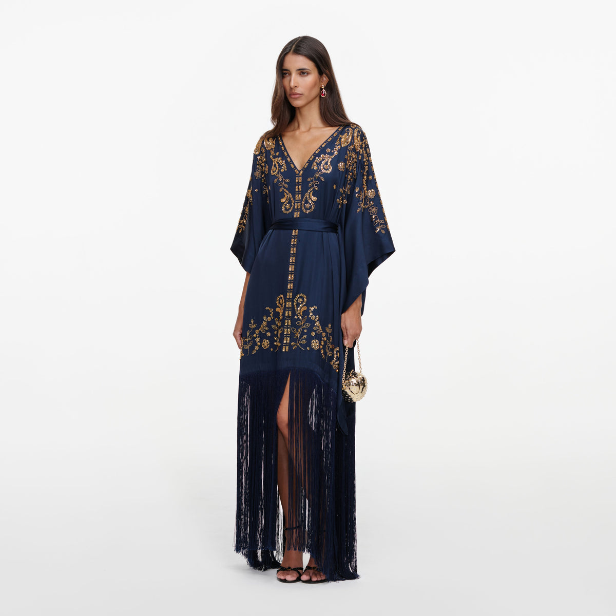 Side view of a woman wearing the Navy Sequin Embroidered Kaftan