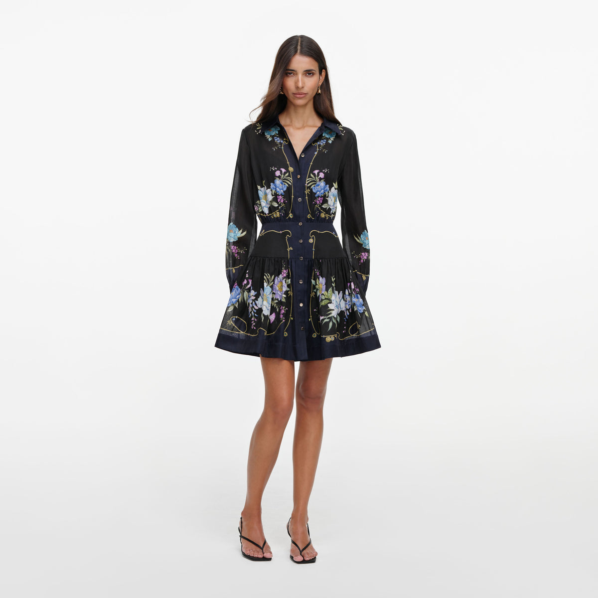 Front view of a woman wearing the Navy Floral Organza Mini Dress