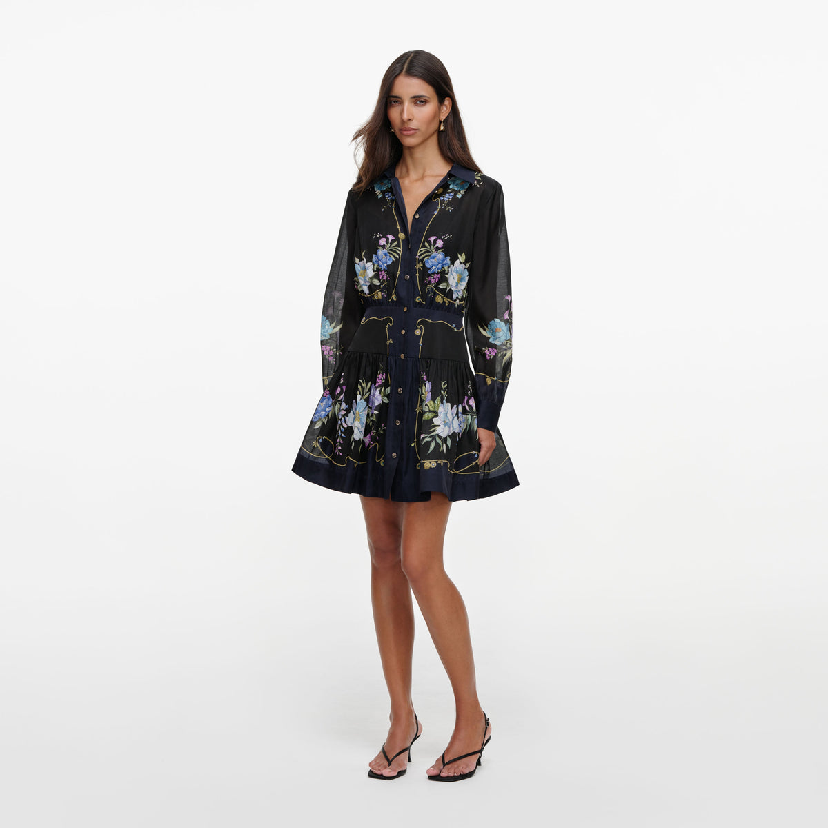 Side view of a woman wearing the Navy Floral Organza Mini Dress