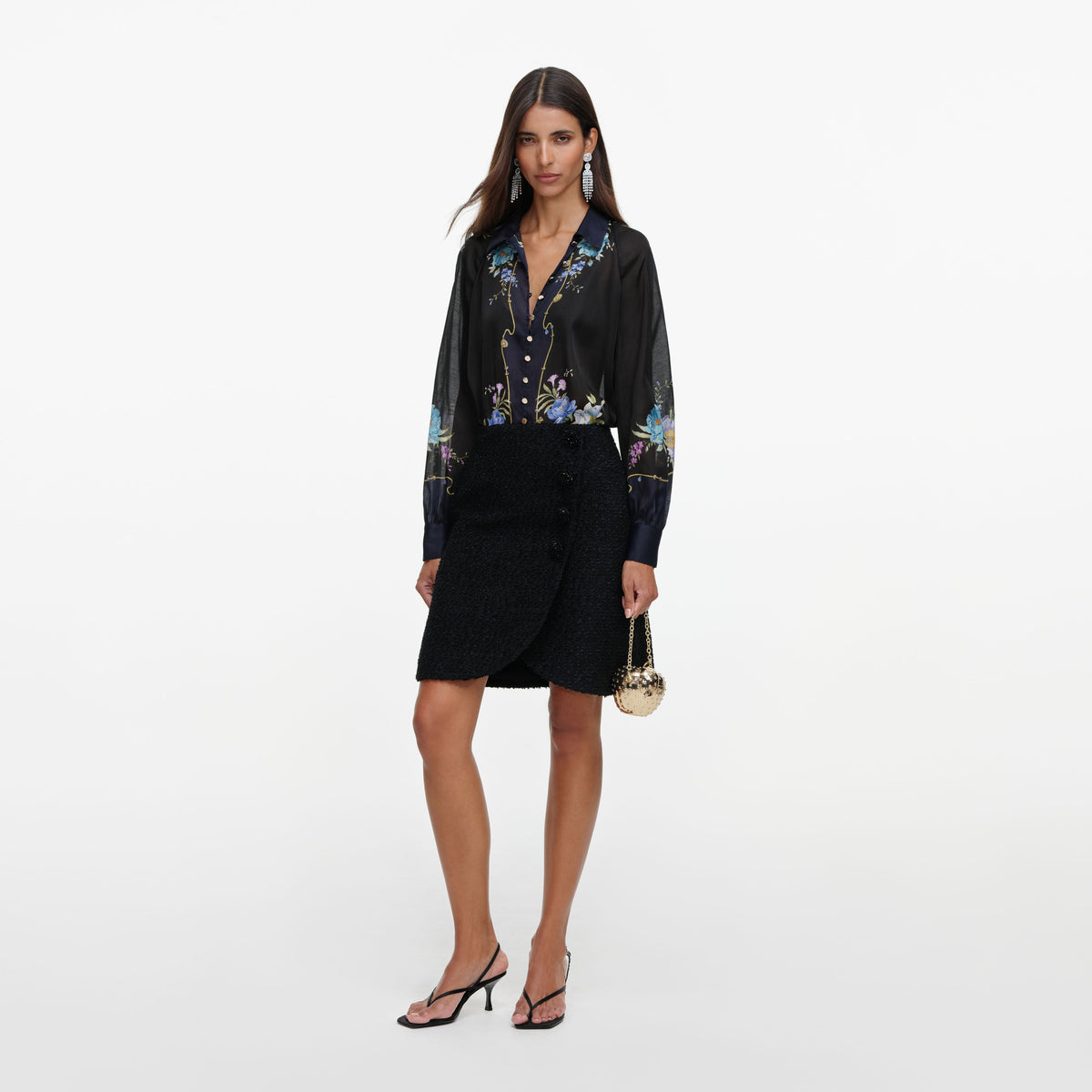 Side view of a woman wearing the Navy Floral Organza Blouse