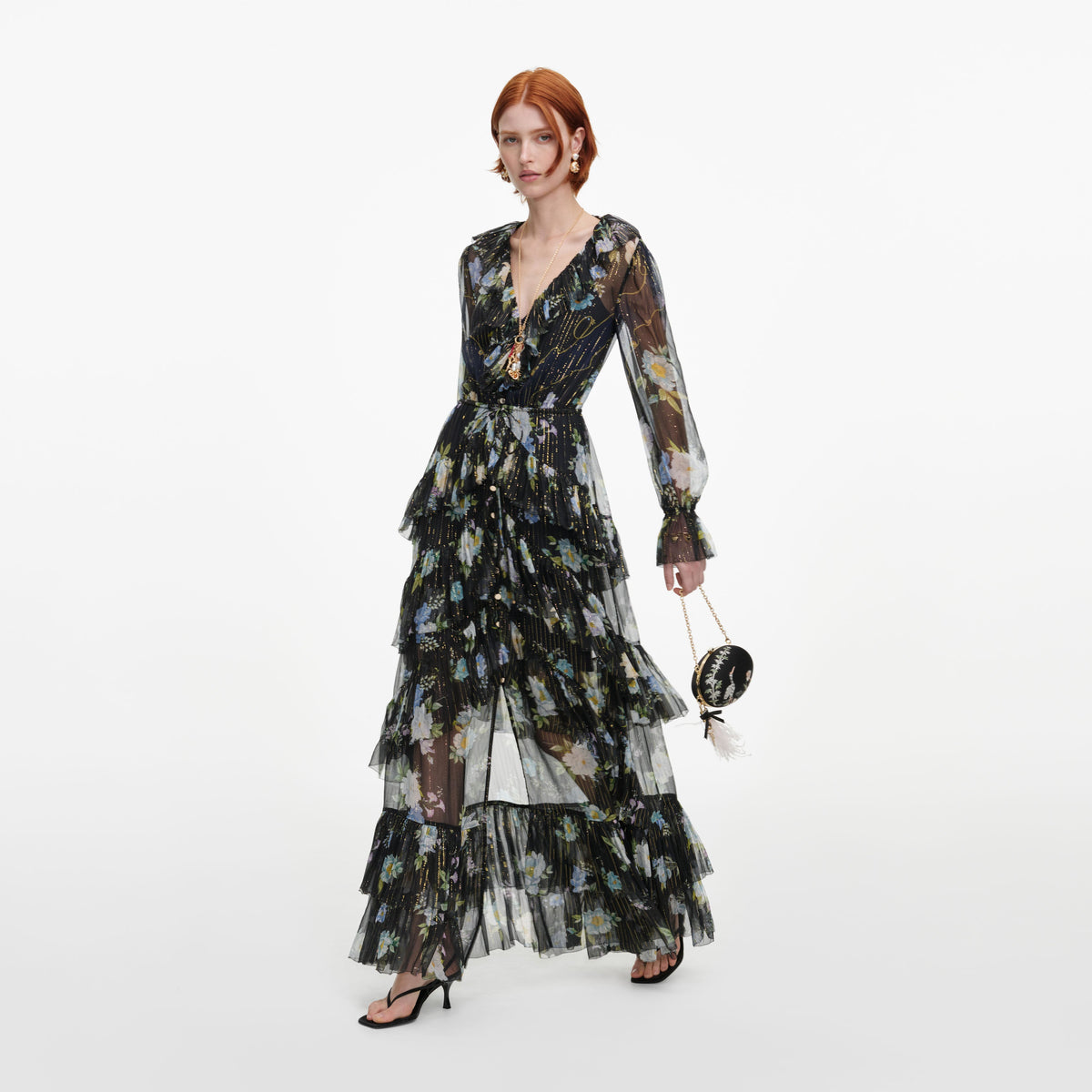 Side view of a woman wearing the Navy Floral Georgette Maxi Dress