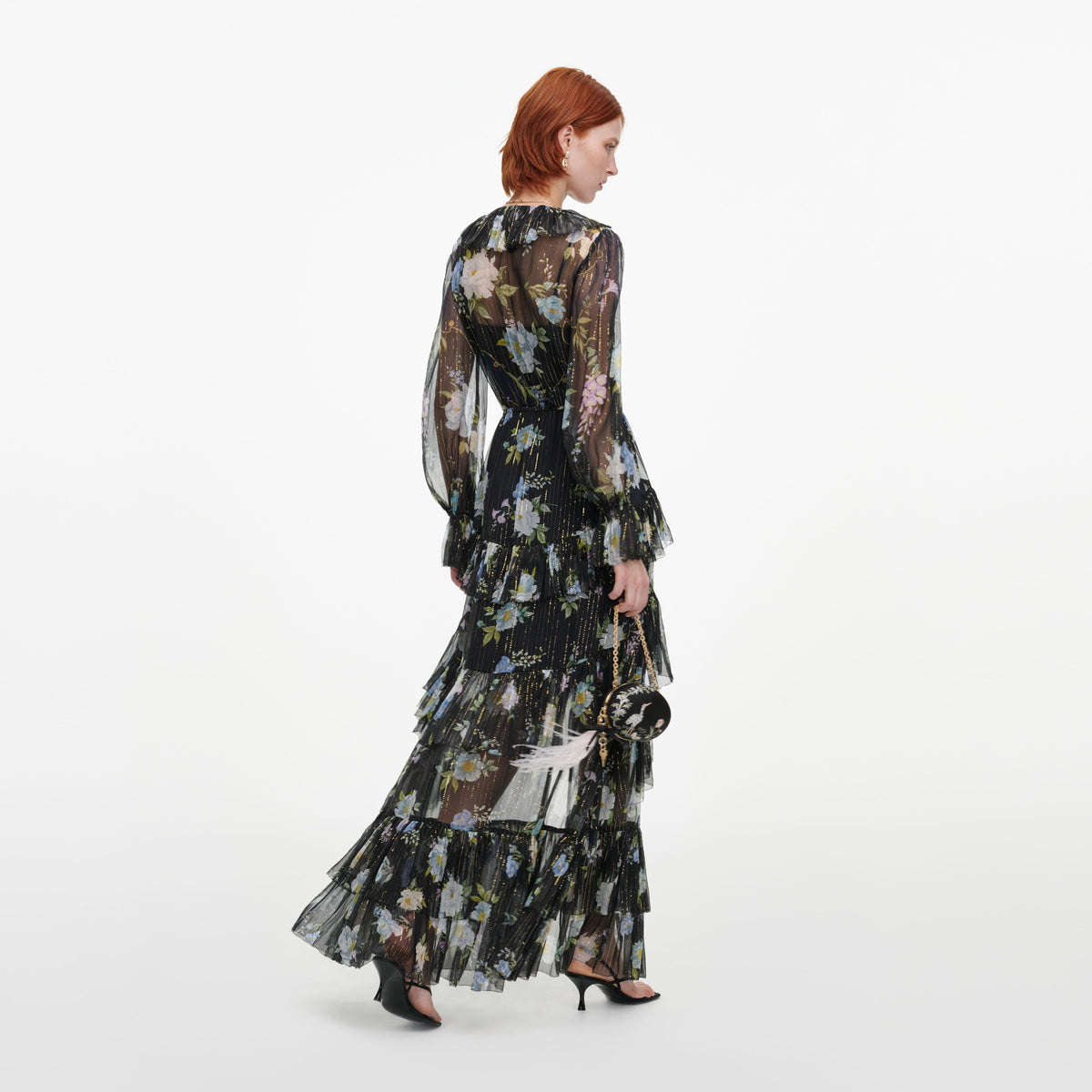 Back view of a woman wearing the Navy Floral Georgette Maxi Dress