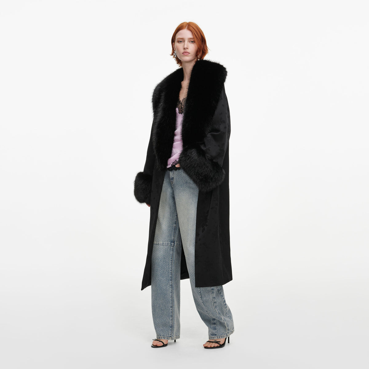 Side view of a woman wearing the Black Jacquard Fur Collar Coat