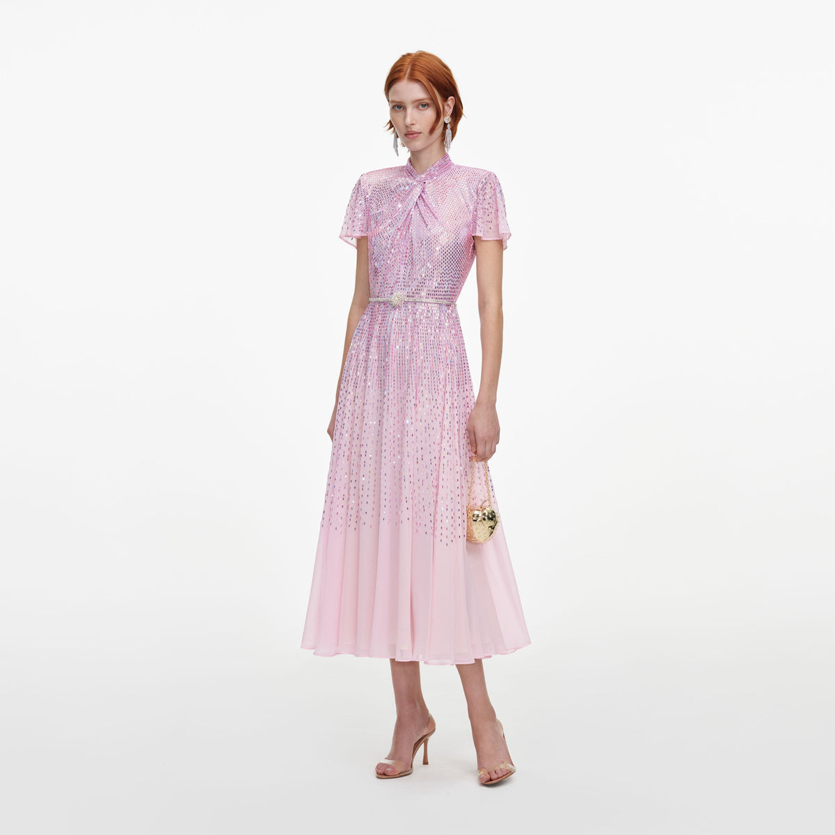 Side view of a woman wearing the Pink Ombre Rhinestone Twist Midi Dress