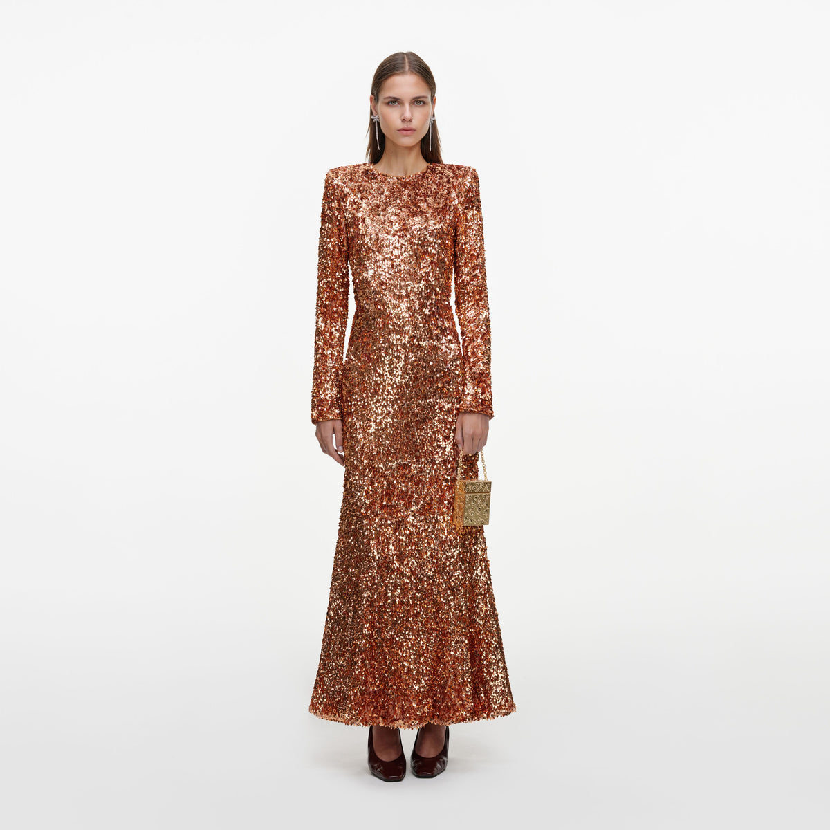Front view of a woman wearing the Gold Sequin Maxi Dress