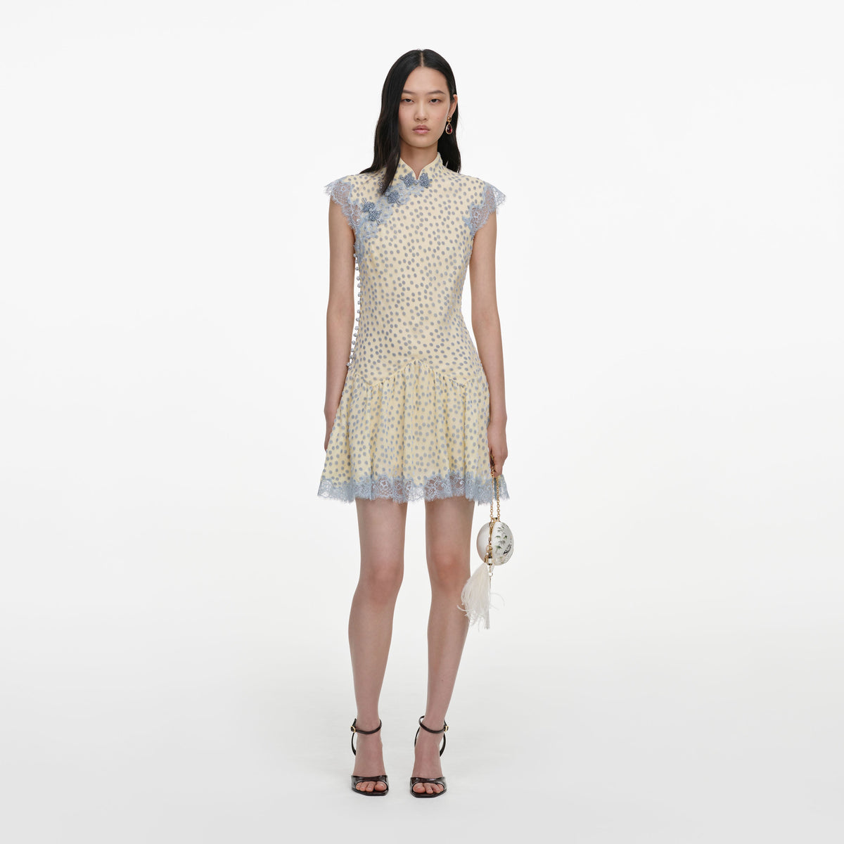 Front view of a woman wearing the Yellow Devore Polka Dot Mini Dress