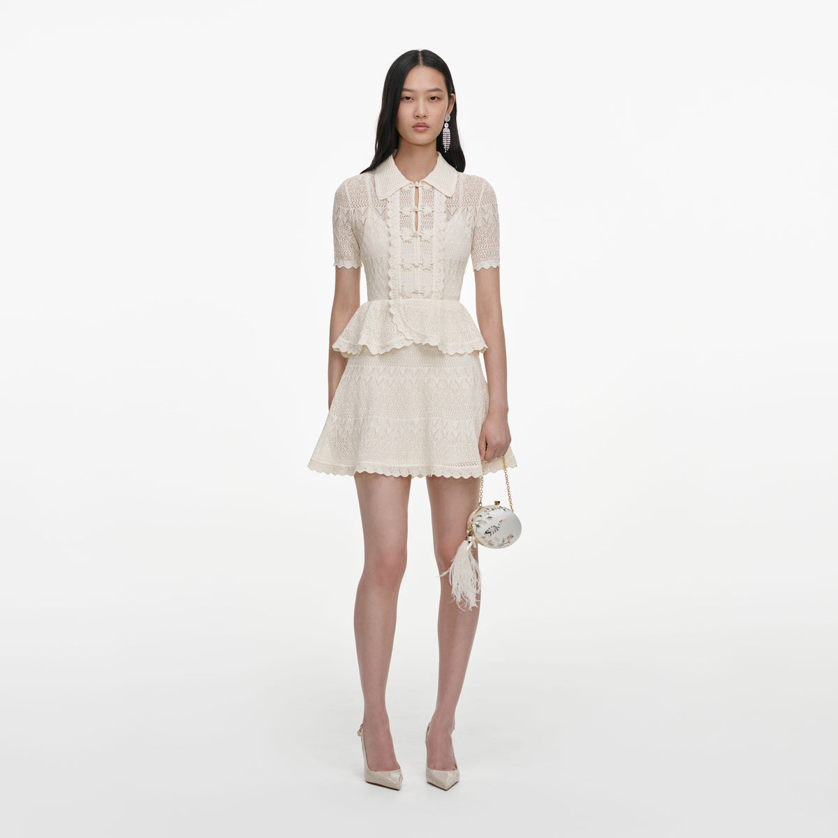 Front view of a woman wearing the Cream Pointelle Knit Wrap Peplum Dress