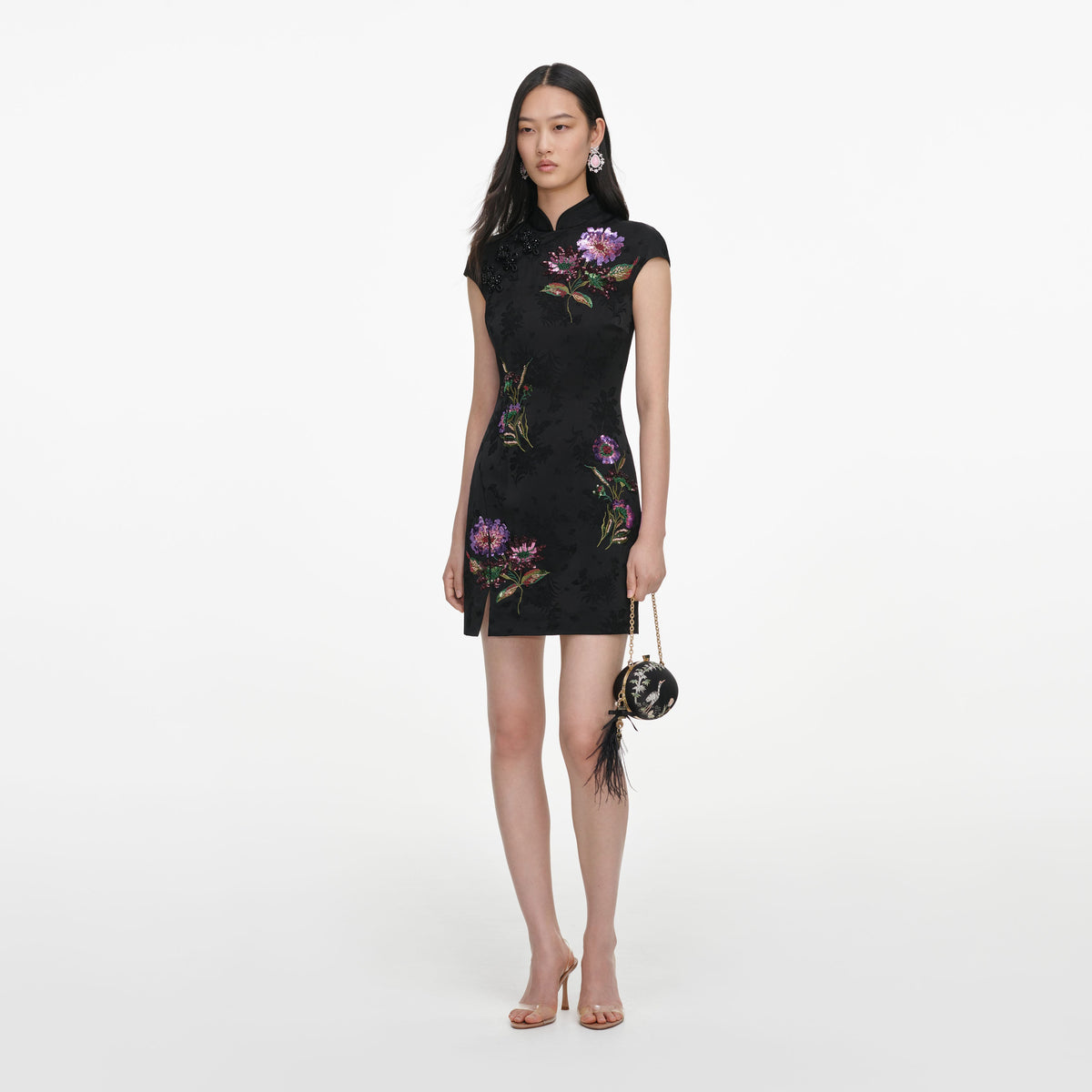 Side view of a woman wearing the Black Jacquard Sequin Embroidered Mini Dress