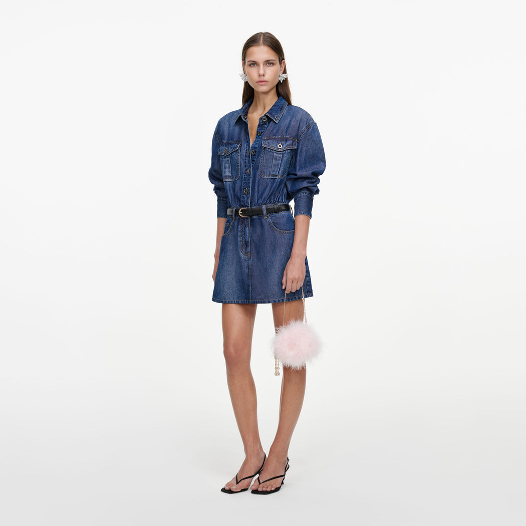 Side view of a woman wearing the Lightweight Denim Mini Dress
