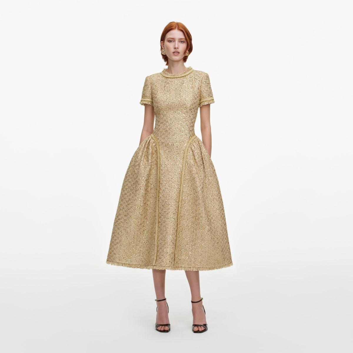 Front view of a woman wearing the Gold Sequin Boucle Midi Dress