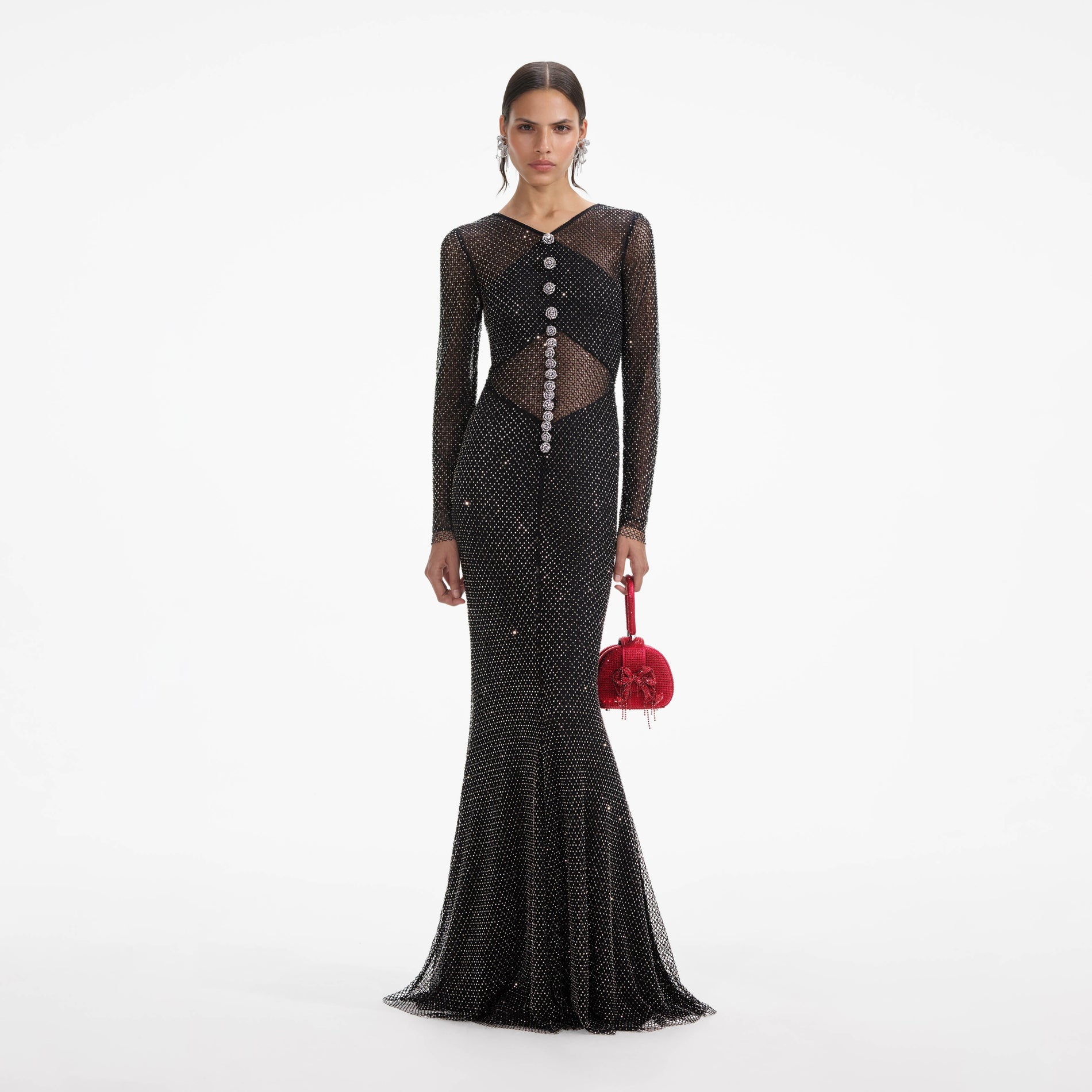 Front view of a woman wearing the Black Rhinestone Fishnet Crossover Maxi Dress