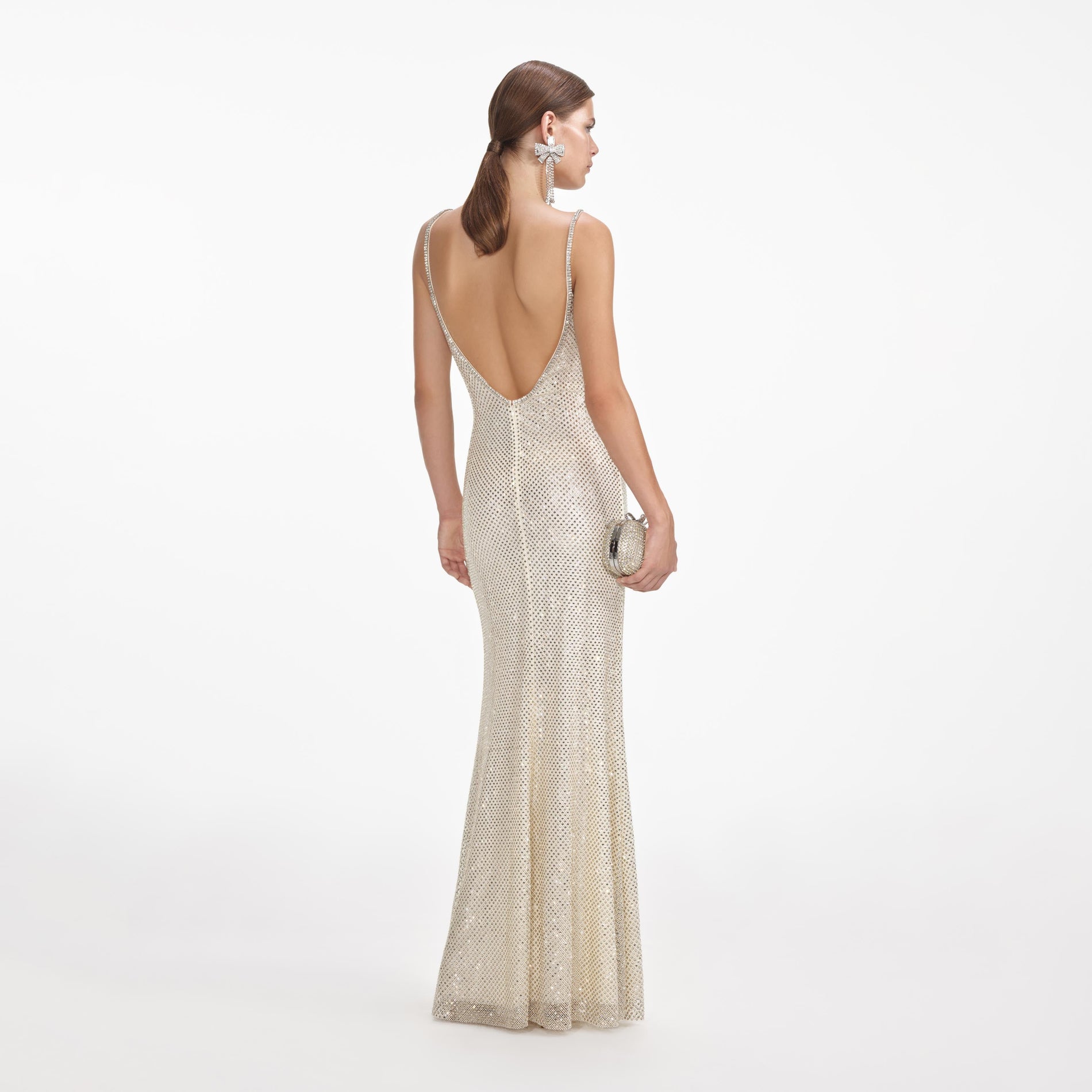 Back view of a woman wearing the Cream Square Rhinestone Fishnet Maxi Dress