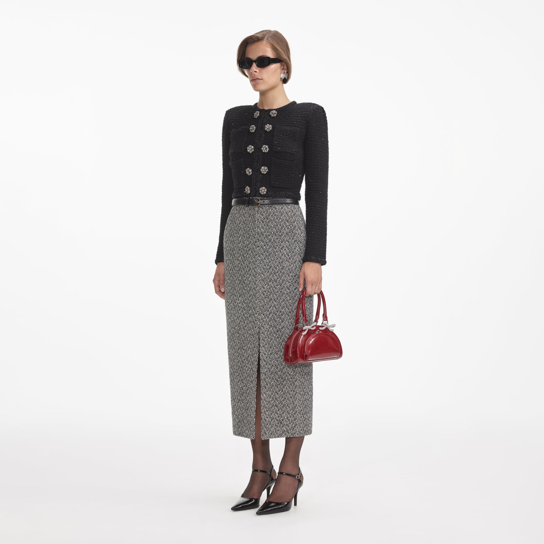 Side view of a woman wearing the Black Textured Knit Jacket