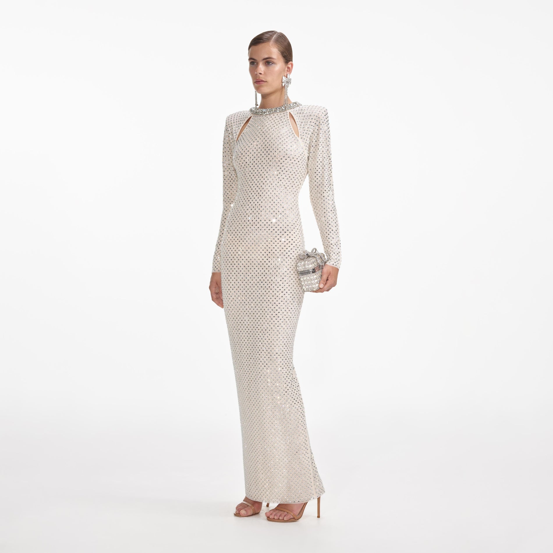 Side view of a woman wearing the Cream Rhinestone Diamante Trim Maxi Dress