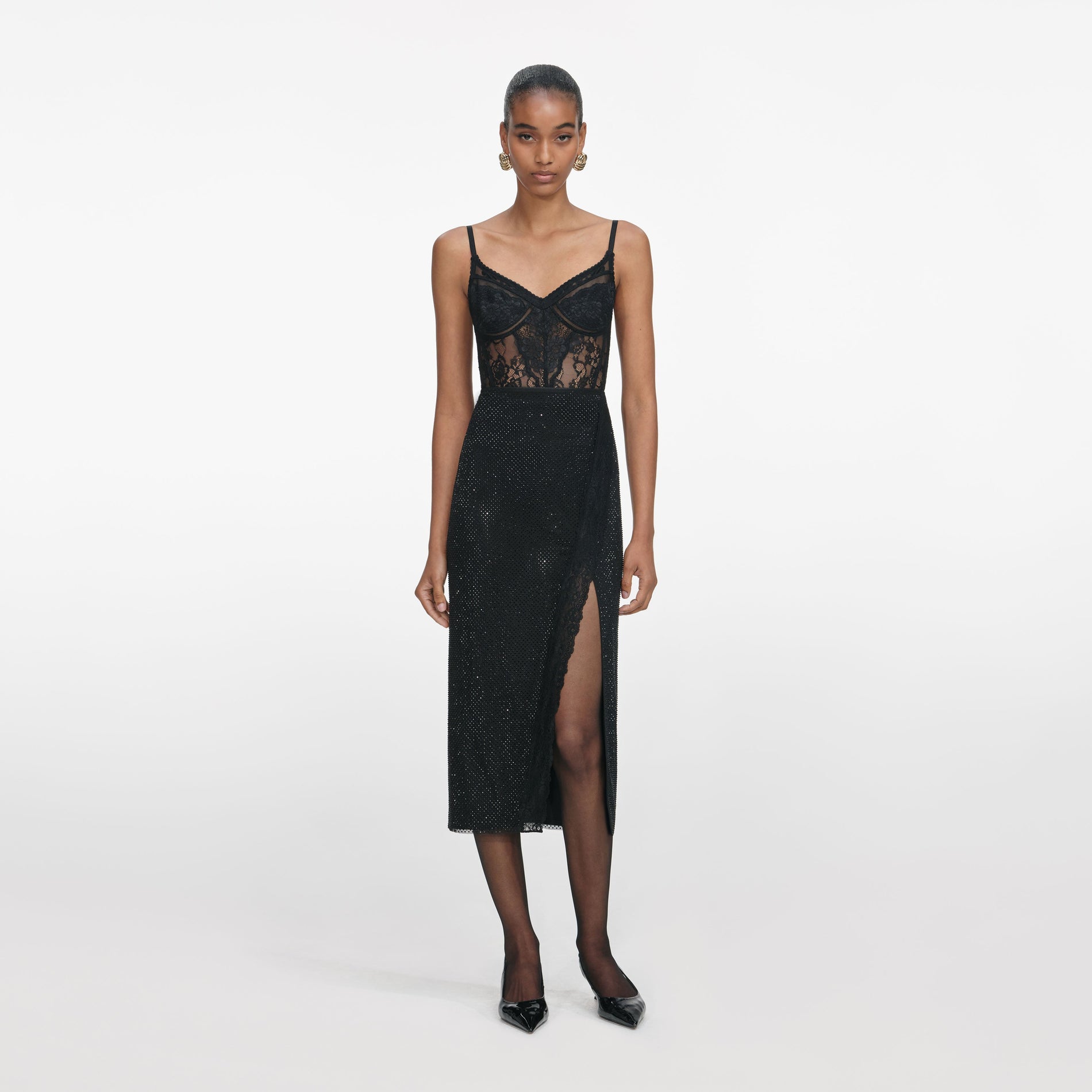 Front view of a woman wearing the Black Rhinestone Midi Skirt