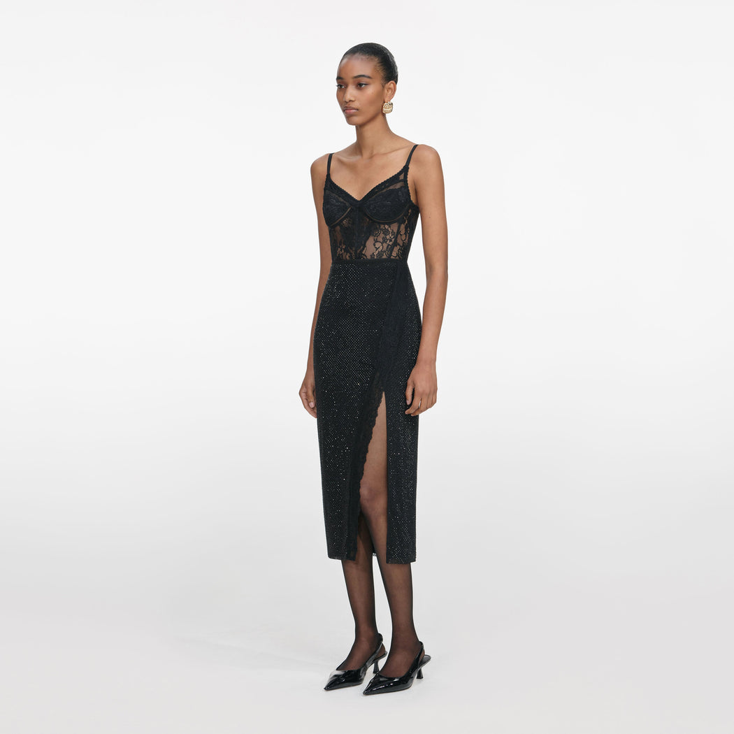 Side view of a woman wearing the Black Rhinestone Midi Skirt