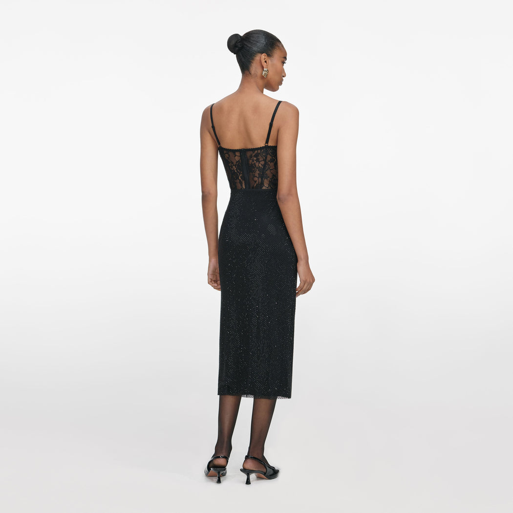 Back view of a woman wearing the Black Rhinestone Midi Skirt
