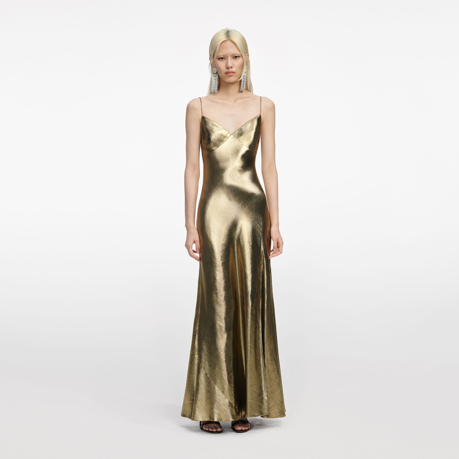 Front view of a woman wearing the Gold Metallic Strappy Maxi Dress