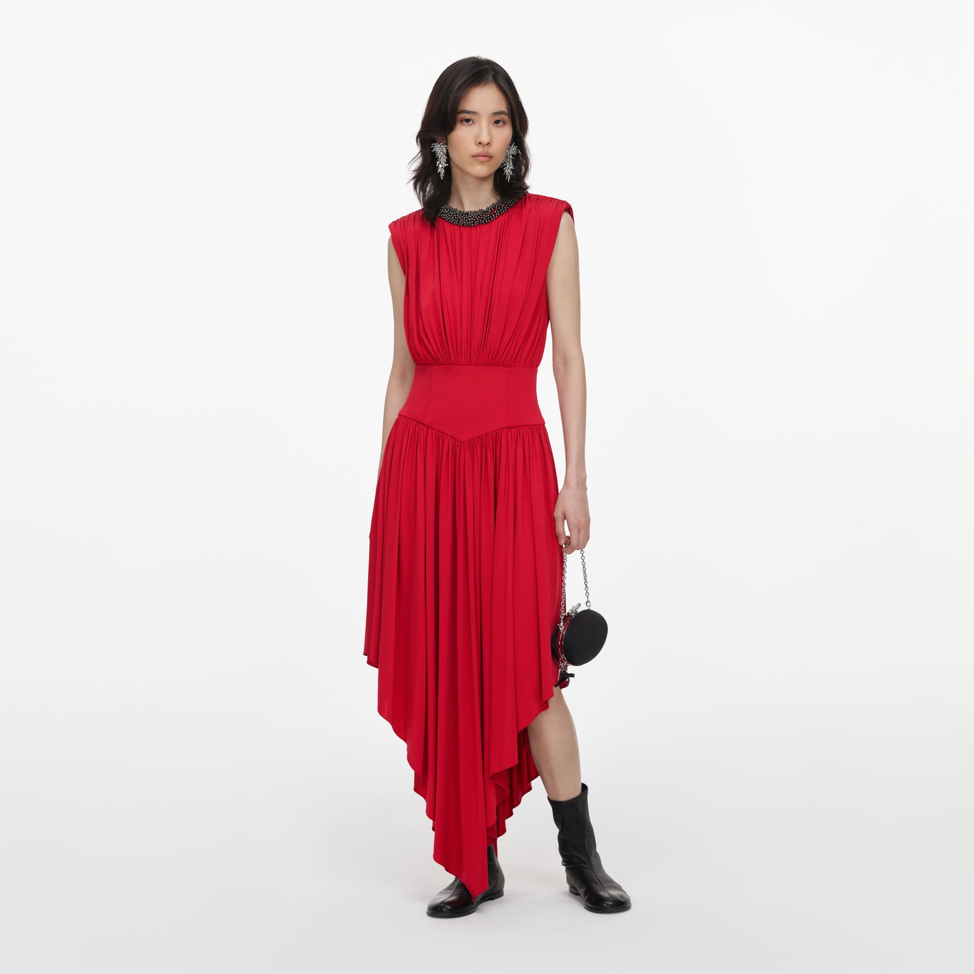 Front view of a woman wearing the Red Jersey Drape Asymmetric Midi Dress