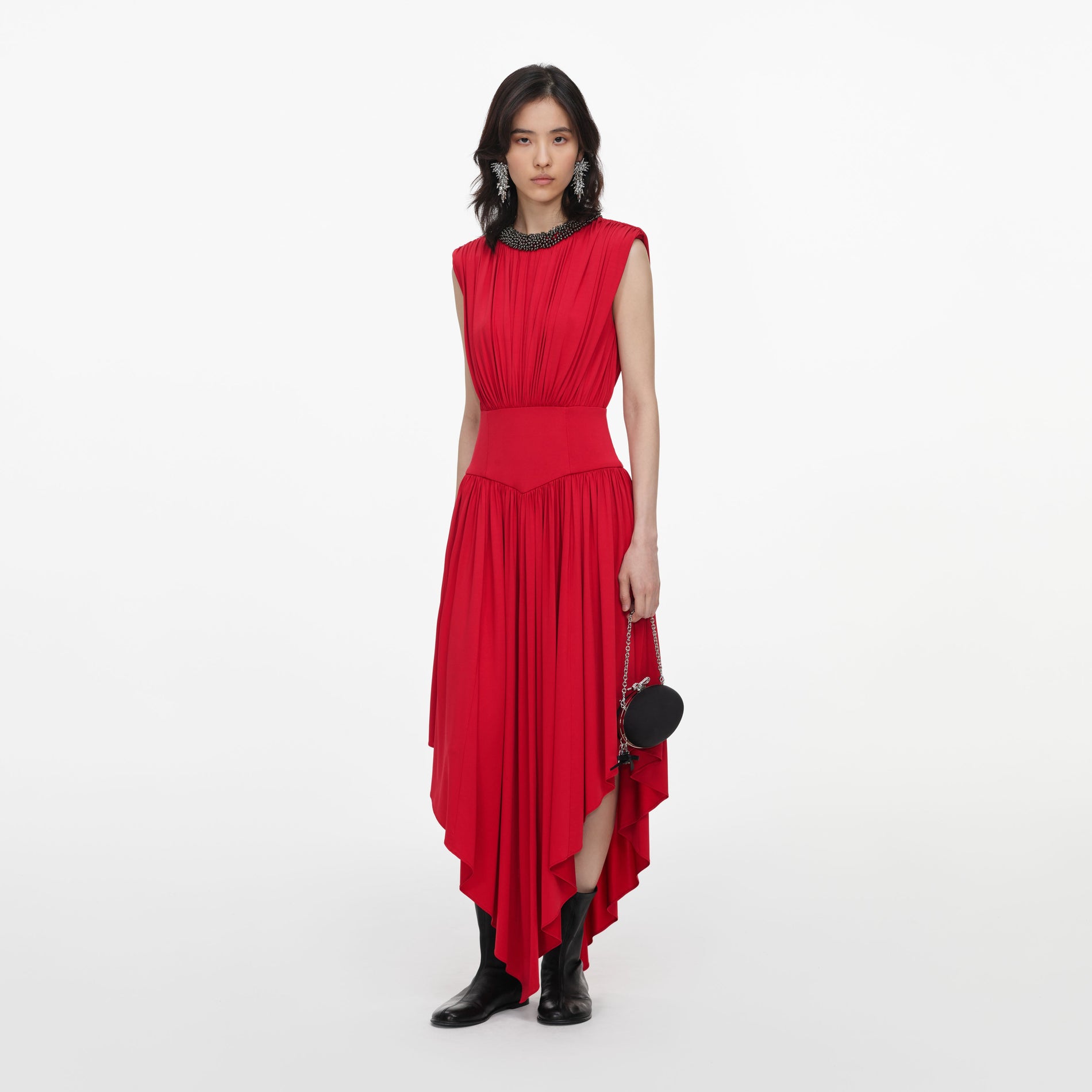 Side view of a woman wearing the Red Jersey Drape Asymmetric Midi Dress