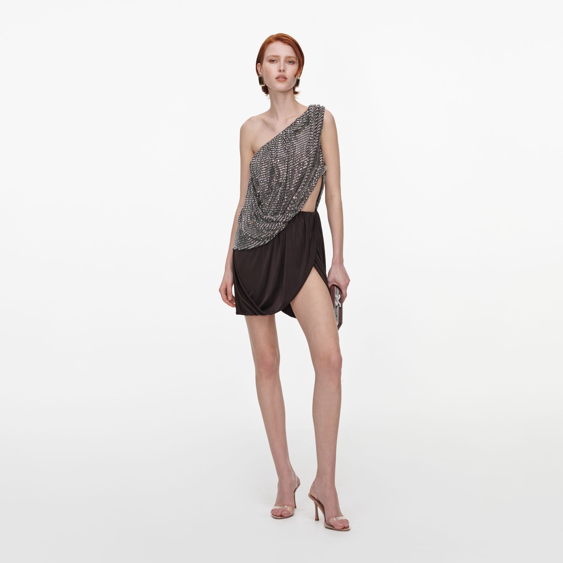 Front view of a woman wearing the Rhinestone One Shoulder Drape Mini Dress