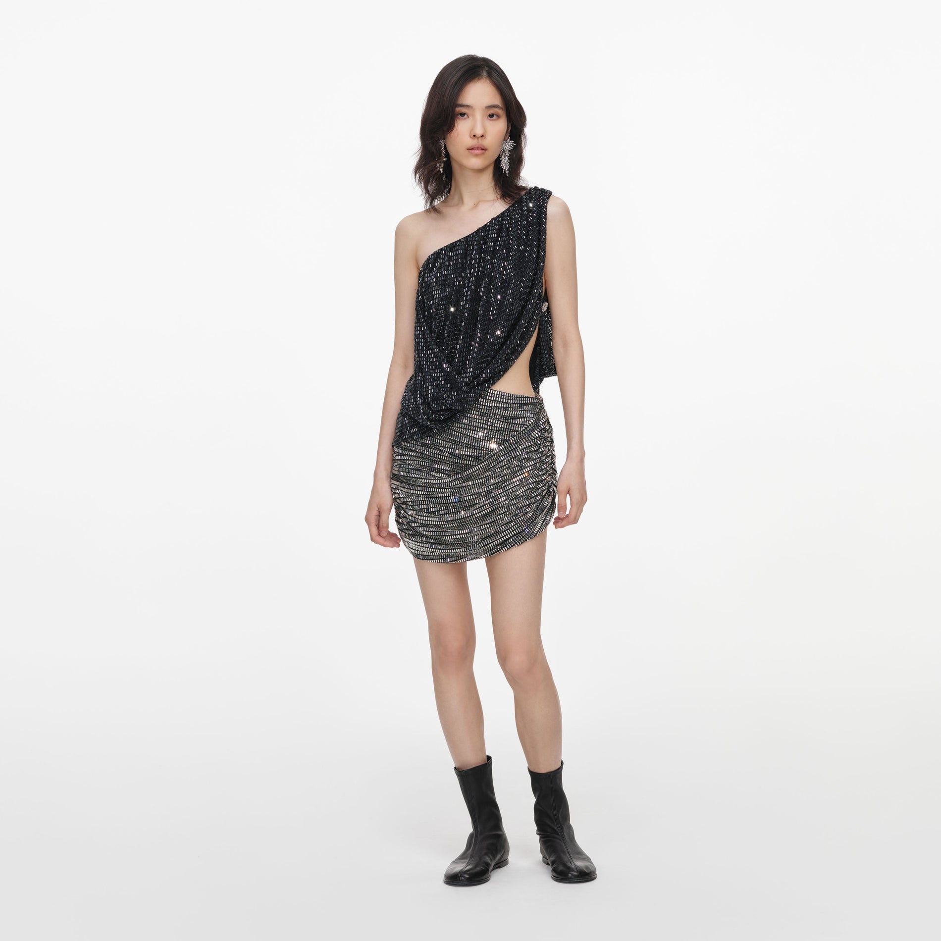 Front view of a woman wearing the Black Rhinestone One Shoulder Drape Top