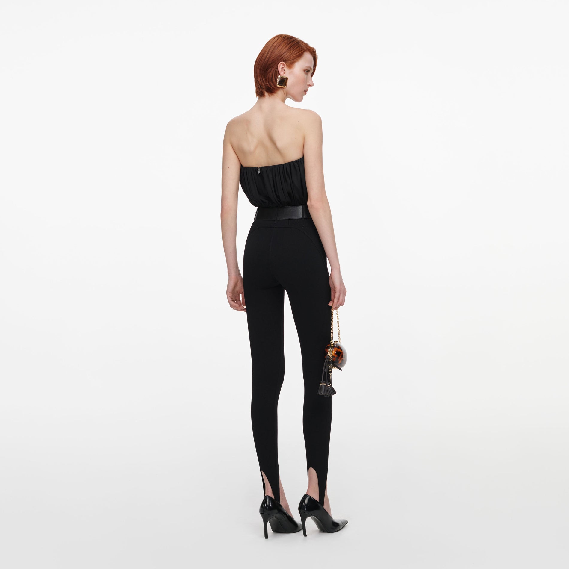 Back view of a woman wearing the Black Bandeau Jersey Top