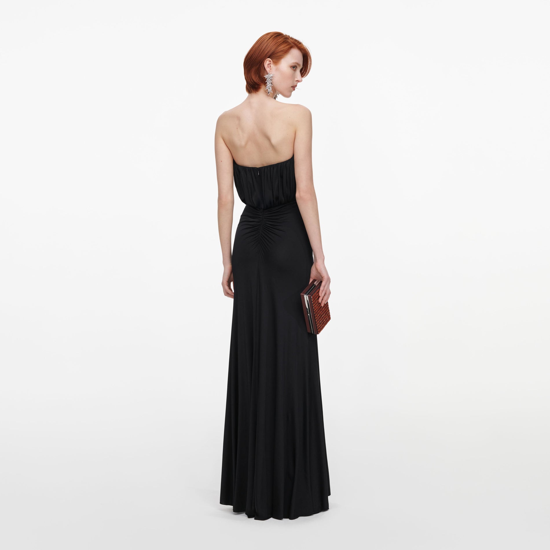 Back view of a woman wearing the Black Jersey Bandeau Maxi Dress