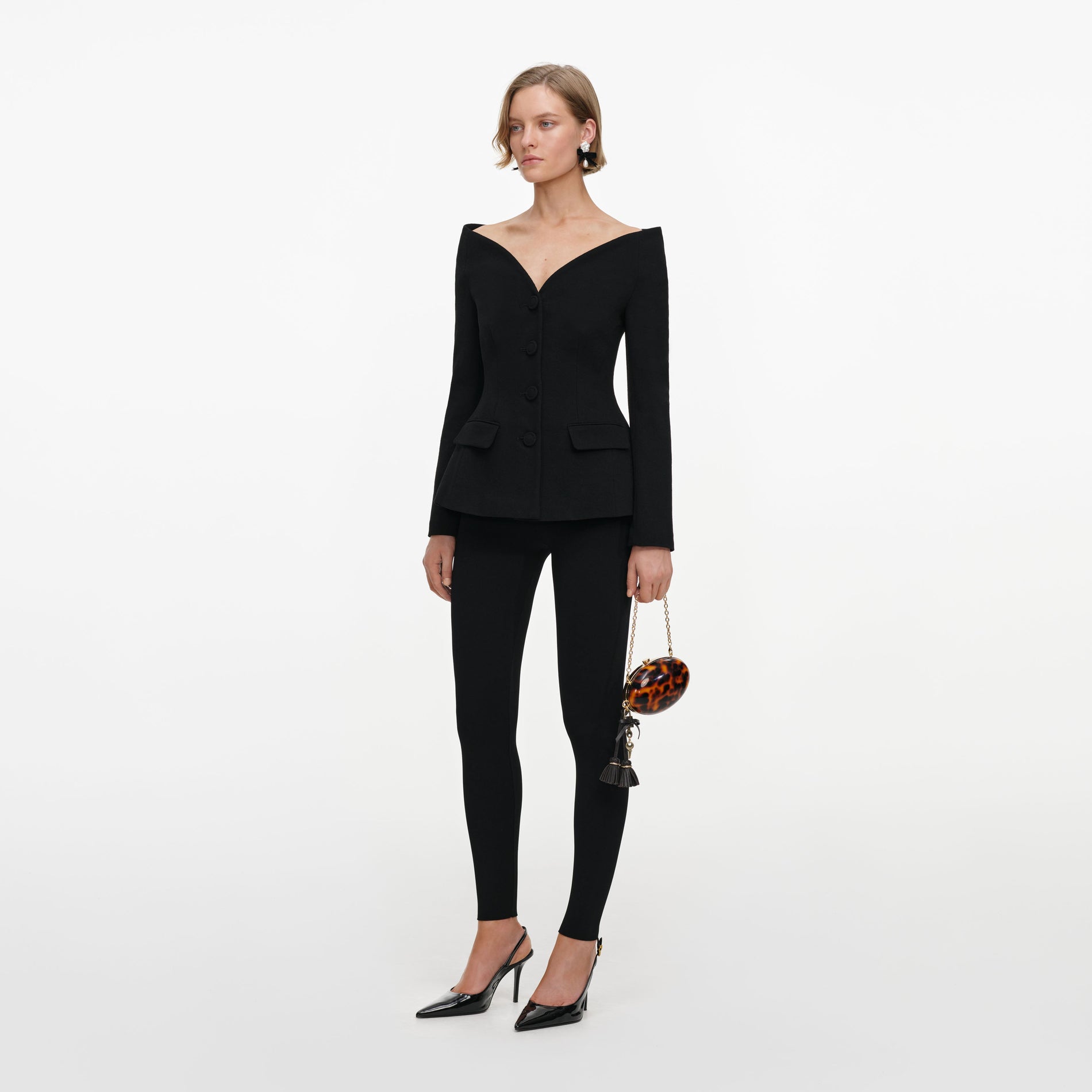 Side view of a woman wearing the Black Wool Crepe Jacket