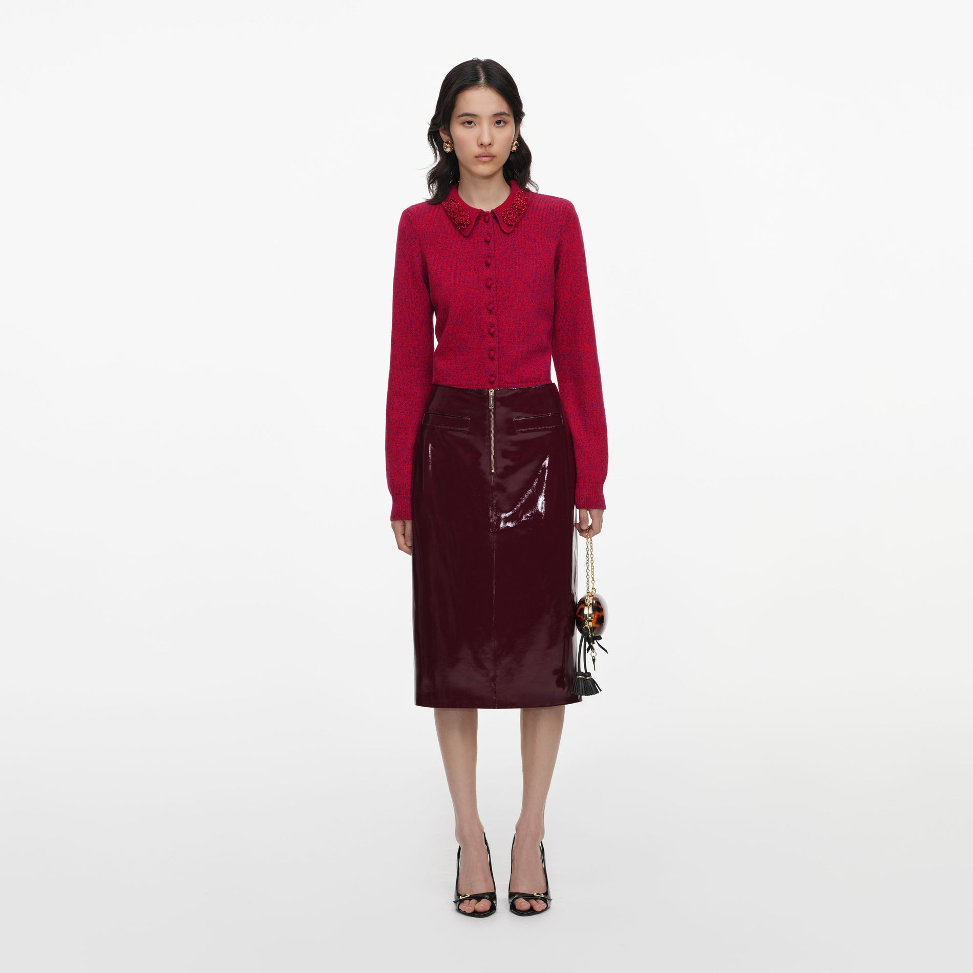 Front view of a woman wearing the Red Flower Knit Cardigan