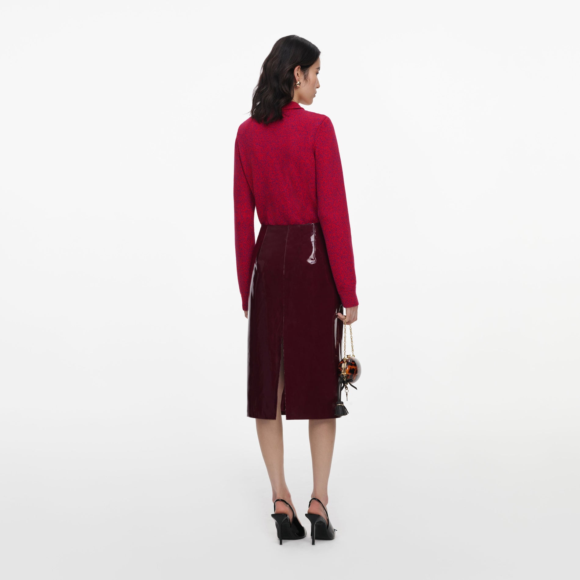 Back view of a woman wearing the Red Flower Knit Cardigan