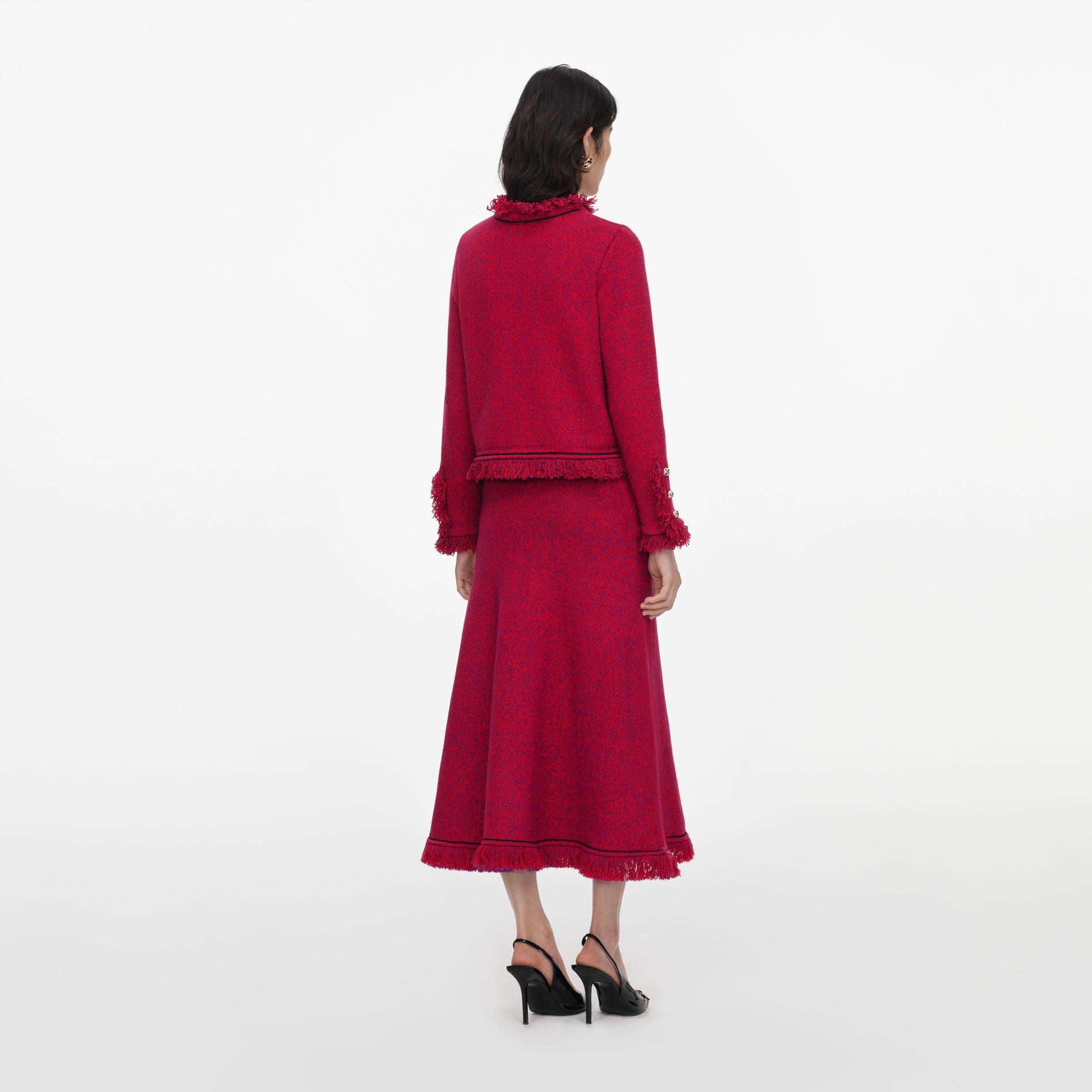 Back view of a woman wearing the Red Frayed Knit Midi Skirt