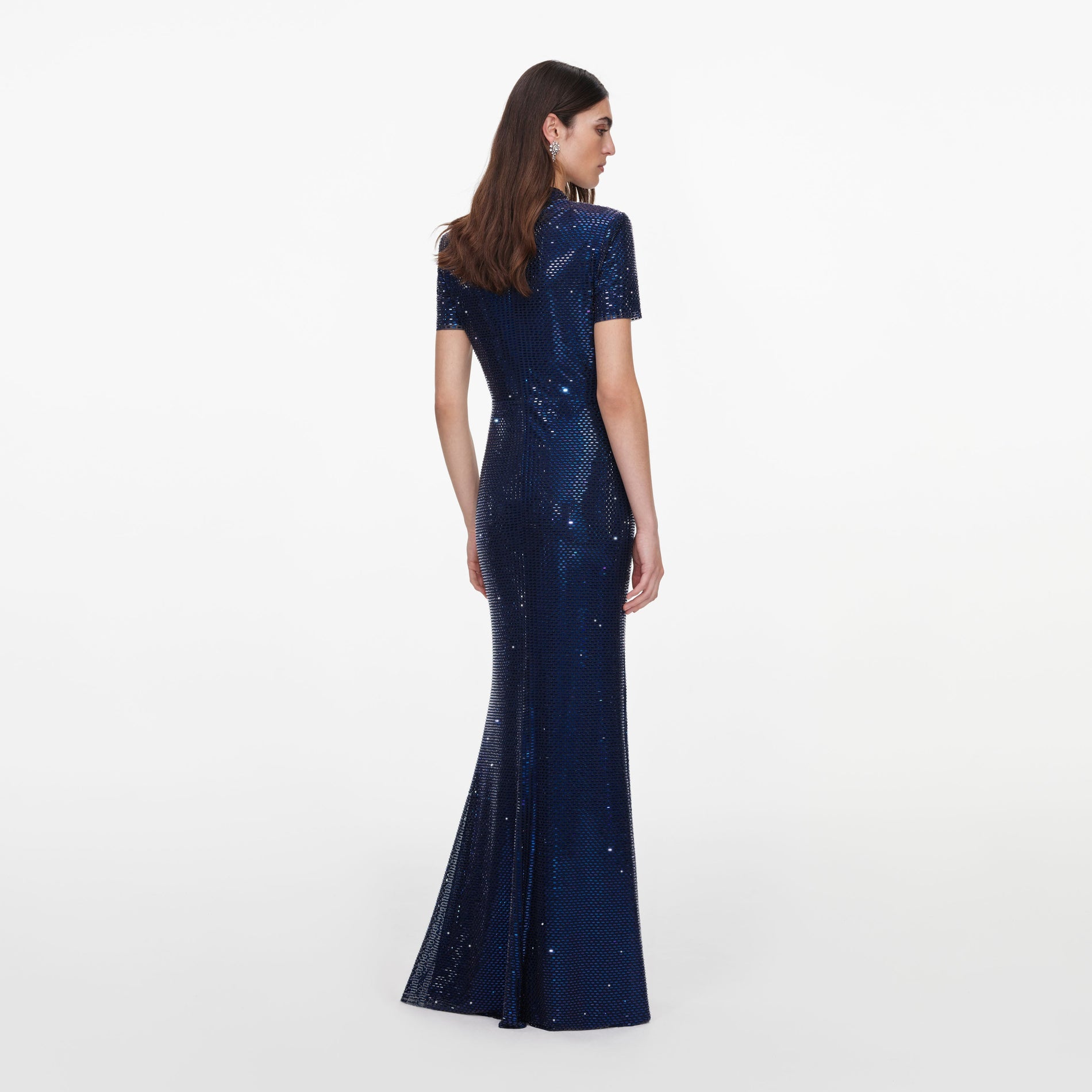 Back view of a woman wearing the Navy Rhinestone Mesh Twist Maxi Dress