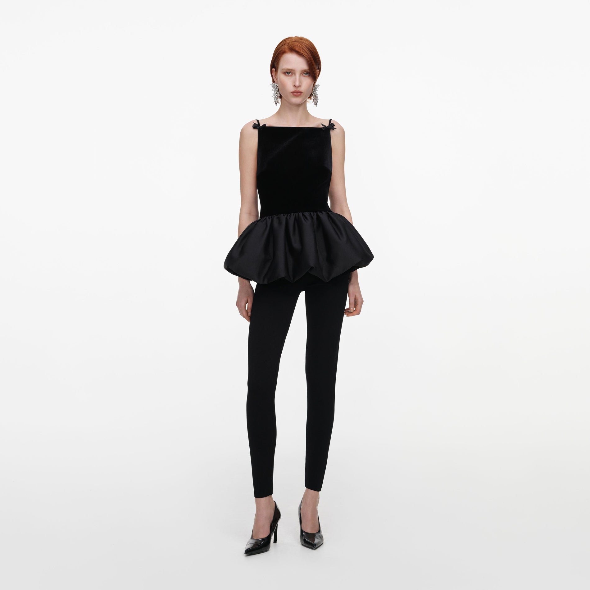Front view of a woman wearing the Black Panel Knit Leggings