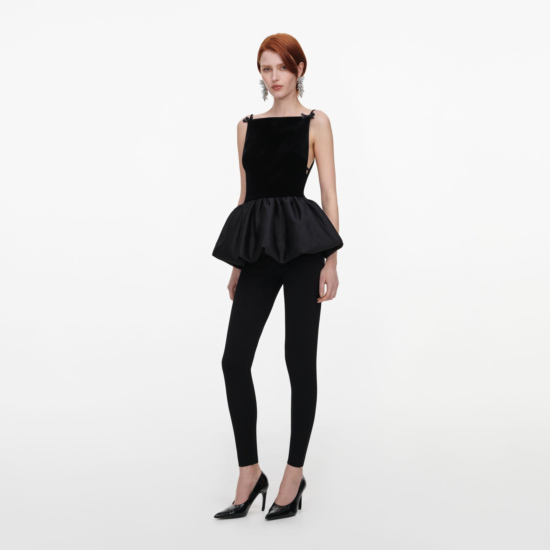 Side view of a woman wearing the Black Panel Knit Leggings